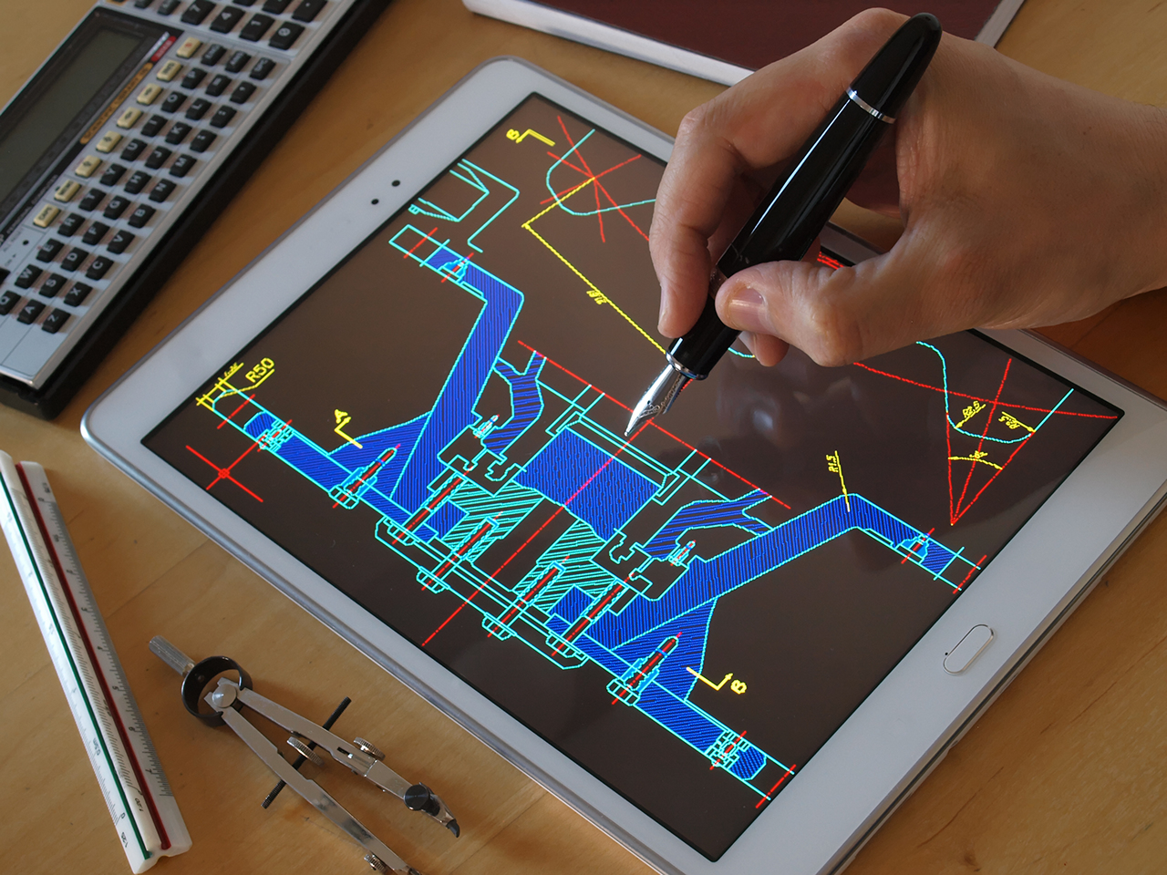 engineer designer working on cad blueprint using tablet computer tool    ; Shutterstock ID 604821596; purchase_order: -; job: -; client: -; other: -